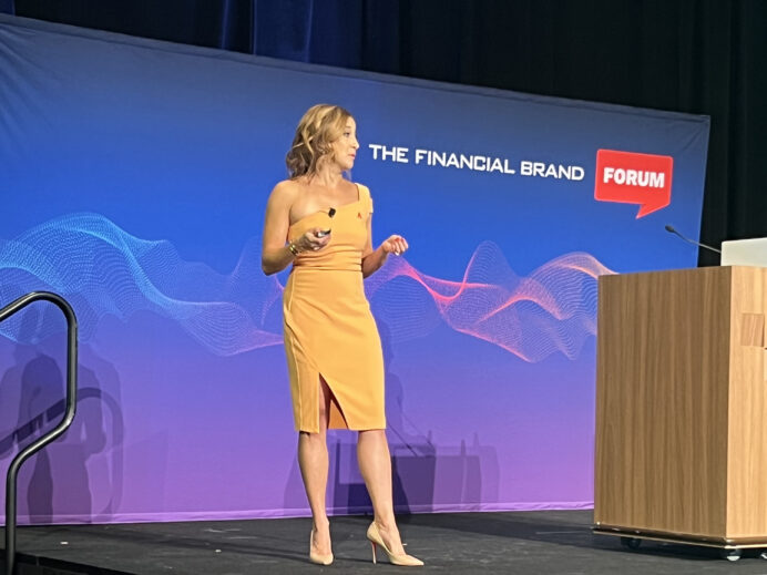 Gina Bleedorn on stage speaking at The Financial Brand Forum