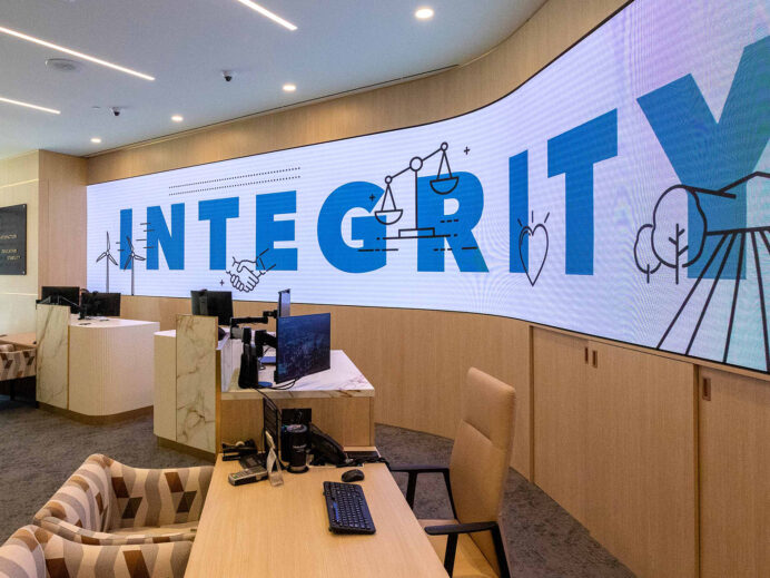 Digital signage display with the word "Integrity" on-screen
